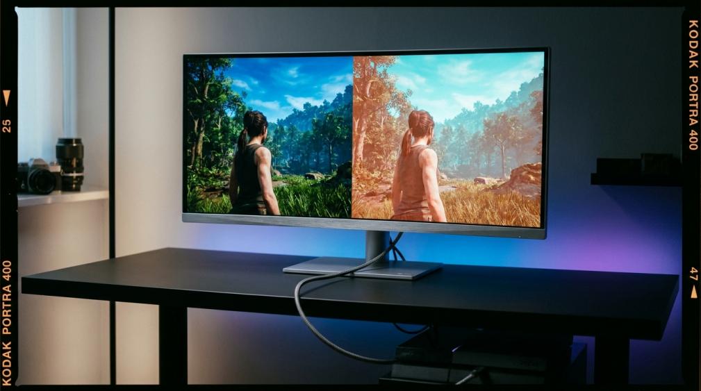 Gaming monitor showing HDR color shift comparison — accurate colors on the left versus orange-red and cyan color cast on the right