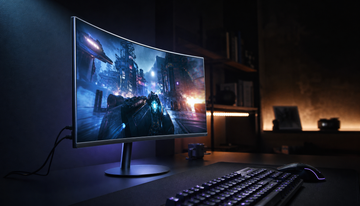 Gaming monitor showing fast-action gameplay with HDMI cable connected, illustrating HDMI QFT and input latency in a dark home office setup
